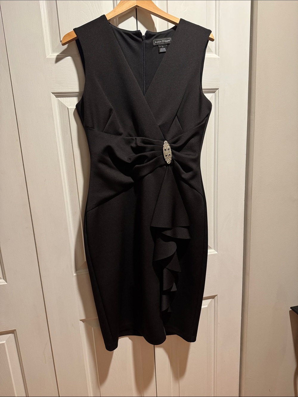 JESSICA HOWARD Black Sleeveless Sheath Dress with Draped Ruffle and Brooch